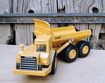 Camión Caterpillar 2431 clásico. Camión volquete articulado. ¡Un juguete miniatura de fundición precioso! ¡Me encanta!