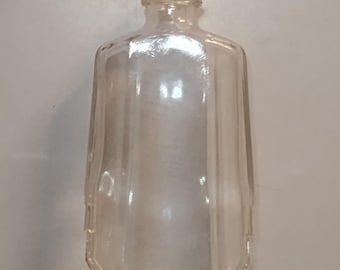 Aceite vintage para el cabello, botella de barbería antigua, década de 1940.