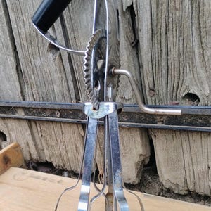 Vintage hand held rotary mixer/egg beater.
