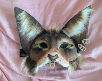 brown and gold therian cat mask