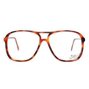 Op de afbeelding: Aviator-stijl bril met schildpadpatroon en heldere glazen. De merknaam "Invicta Line" staat gedrukt op de rechterpoot.