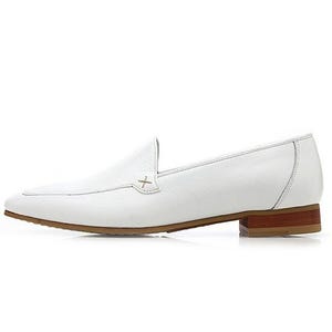 May include: A white leather loafer with a brown sole and heel. The shoe features a pointed toe and a decorative cross-stitch detail on the vamp. The heel measures approximately 1 inch.