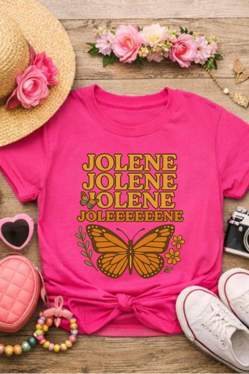 Jolene Dolly T-shirt for Girls brings music to life. Heliconia colored shirt with Jolene, Jolene, Jolene, Jolene written on it in gold and orange letters featuring butterflies and flowers.
Jolene Dolly T-shirt for Girls, Youth Music Tee, Dolly Shirt for Kids, Kids Graphic Top, Fan Gift, Cute Fan Gift, Graphic Top