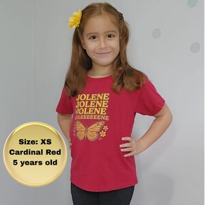 Jolene Dolly T-shirt for Girls brings music to life. Cardinal Red colored shirt with Jolene, Jolene, Jolene, Jolene written on it in gold and orange letters featuring butterflies and flowers.
Jolene Dolly T-shirt for Girls, Youth Music Tee, Dolly Shirt for Kids, Kids Graphic Top, Fan Gift, Cute Fan Gift, Graphic Top