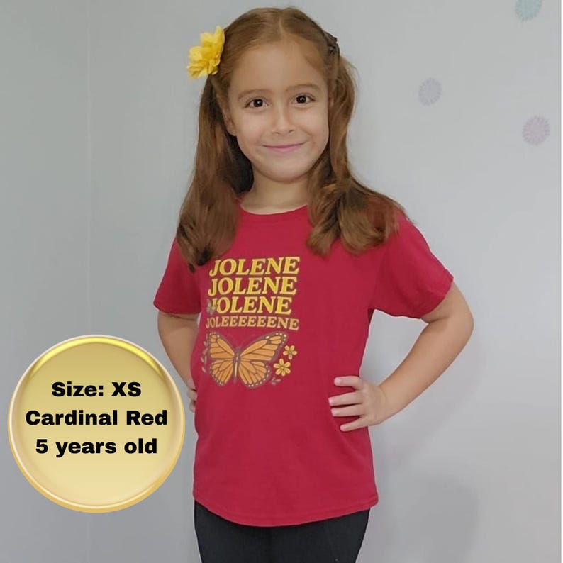 Jolene Dolly T-shirt for Girls brings music to life. Cardinal Red colored shirt with Jolene, Jolene, Jolene, Jolene written on it in gold and orange letters featuring butterflies and flowers.
Jolene Dolly T-shirt for Girls, Youth Music Tee, Dolly Shirt for Kids, Kids Graphic Top, Fan Gift, Cute Fan Gift, Graphic Top