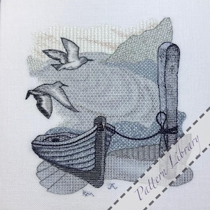May include: Cross-stitch artwork of a coastal scene. A small boat is tied to a wooden post, with two seagulls in flight. The piece uses blue, grey, and white threads, evoking a calm, nautical atmosphere.
