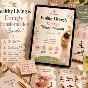 May include: A digital tablet displaying a Healthy Living & Energy Transformation Guide with a person stretching, alongside a printed weekly exercise plan, a smoothie recipe book, a sticky note with healthy habits, and a cup of coffee.