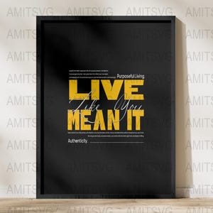 May include: A framed black poster with the words "LIVE Like You MEAN IT" in yellow and white. The poster includes the phrases "Purposeful Living" and "Authenticity."
