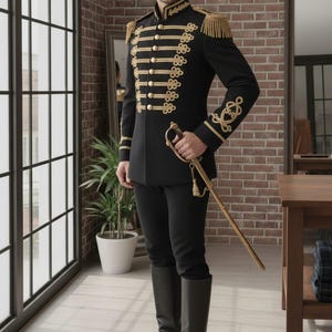 May include: Black military-style jacket with gold trim, epaulets, and buttons. The jacket is paired with black pants and tall black boots. A gold sword is held at the side. The outfit is formal and historical.