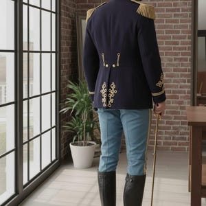 May include: A navy blue military-style jacket with gold trim and epaulets, paired with light blue pants and black boots. The jacket features decorative gold embroidery on the back. A gold-colored sword is held in the right hand.
