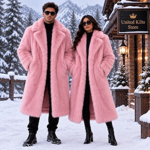 May include: Two long, pink faux fur coats with wide lapels, worn over black turtleneck sweaters and black trousers. Both individuals wear dark sunglasses. A wooden sign with the text United Kilts Store is visible in the snowy outdoor setting.