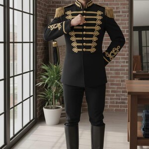 May include: A black military-style jacket with gold trim, epaulets, and decorative buttons. The jacket is paired with black pants and tall black boots. The outfit is formal and elegant, suitable for a costume or special event.