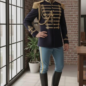 May include: A navy blue military-style jacket with gold trim, epaulets, and decorative buttons. The jacket is paired with light blue pants with a yellow stripe and black riding boots. The outfit is a historical costume.