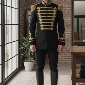 May include: Black military-style jacket with gold trim, epaulets, and decorative buttons. The jacket is paired with black pants and tall black boots. The outfit is formal and reminiscent of historical military uniforms.