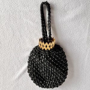 Bolso de mano vintage Le Jule con cierre de acordeón, cuentas negras y rafia