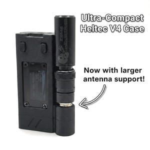 May include: Black Ultra-Compact Heltec V4 Case with larger antenna support. The case has a rectangular body with rounded edges and a cylindrical antenna attachment. The text "Ultra-Compact Heltec V4 Case" and "Now with larger antenna support!" are visible.