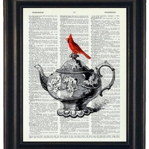 May include: A red cardinal perched on a silver teapot with floral designs. The image is printed on a vintage dictionary page.