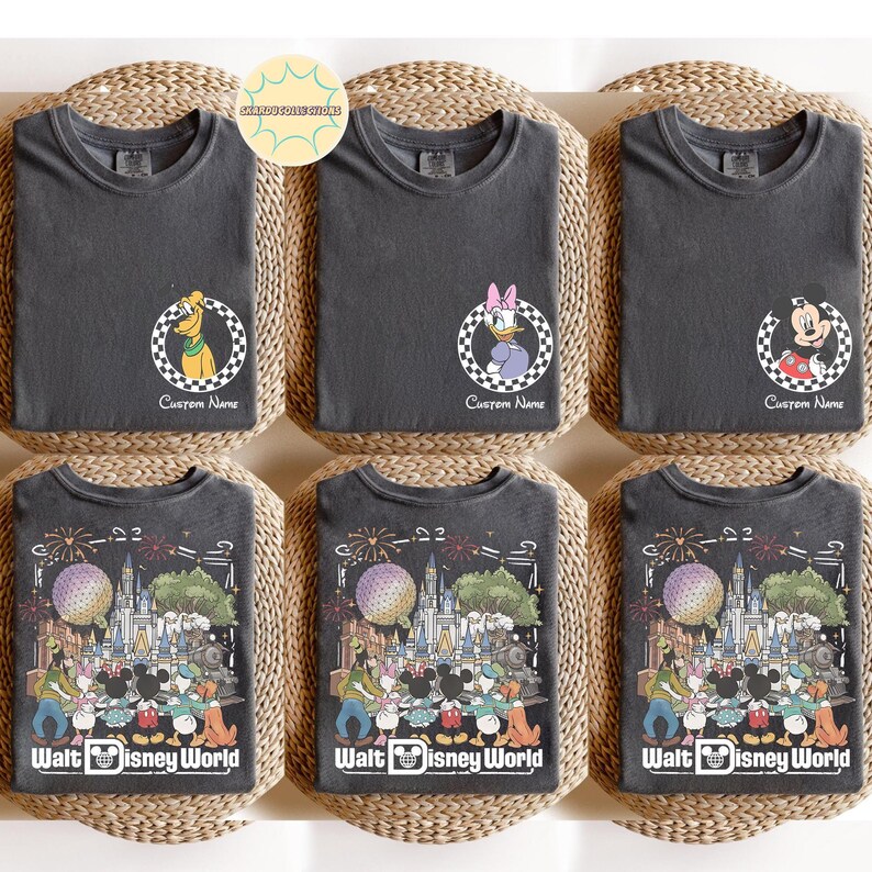 May include: Six dark grey t-shirts with round graphics featuring cartoon characters. The top row includes Pluto, Daisy Duck, and Mickey Mouse. The bottom row features a Walt Disney World design. Each shirt has the text "Custom Name" or "Walt Disney World".