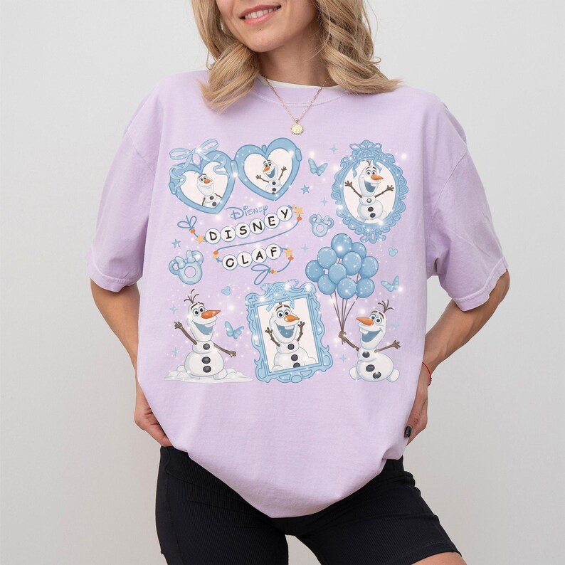 May include: A light purple t-shirt featuring multiple illustrations of Olaf from Disney's Frozen. The design includes Olaf in various poses, hearts, balloons, and the text "Disney Olaf". The shirt has short sleeves and a relaxed fit.