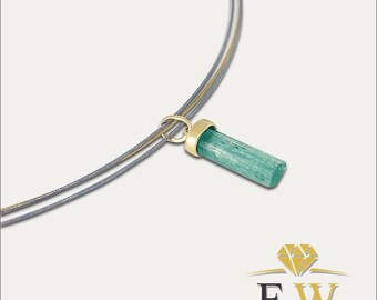 May include: A necklace featuring a cylindrical, light green gemstone pendant capped in polished yellow gold. The pendant hangs from a thin, double-strand grey cord. A logo with a diamond icon and the letters FW is visible in the bottom corner.