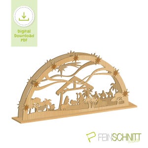 May include: A wooden Nativity scene cutout with a half-circle arch design. The scene depicts the Holy Family, the Three Wise Men, and animals. The arch is decorated with star cutouts. The image also includes the text "Digital Download PDF".