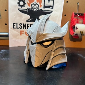 May include: A set of three ceramic mugs with a speckled, matte finish. The mugs are in shades of cream, light gray, and dark gray. Each mug has a simple, minimalist design, perfect for coffee or tea.