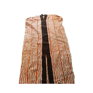 Orange patterned adire dress
