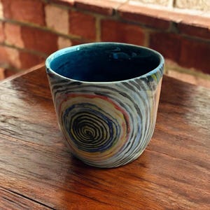 Hand-painted multi-colored ceramic coffee or tea mug 250 ml