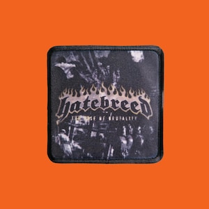 May include: Square black patch featuring the band name "Hatebreed" in a stylized font with flames above the text. The patch also includes the text "The Rise of Brutality" and a grayscale image.