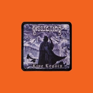 May include: A square patch with a black border featuring a detailed illustration. The image depicts a robed figure with a scythe in a snowy landscape, with the band name "Dissection" and the text "Live Legacy".
