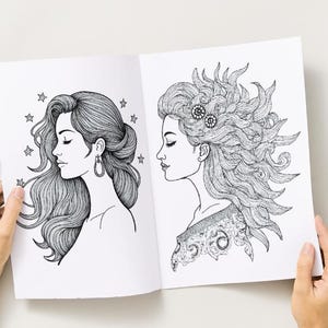 Peut inclure: Une double page d'un livre de coloriage avec deux illustrations d&eacute;taill&eacute;es en noir et blanc de profils de femmes. L'une a des cheveux fluides avec des &eacute;toiles, l'autre a des cheveux &eacute;labor&eacute;s avec des &eacute;l&eacute;ments d&eacute;coratifs. Le livre est ouvert.