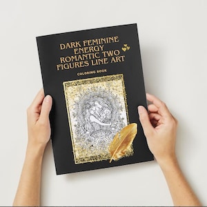 May include: A black coloring book titled "Dark Feminine Energy Romantic Two Figures Line Art" with a gold-framed illustration of two figures embracing. A gold feather rests on the book. The book is held by two hands against a white background.