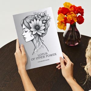 May include: A white ceramic mug with a black handle and the text "But First, Coffee" in a bold, black font. The mug is set against a neutral background, highlighting its simple design.