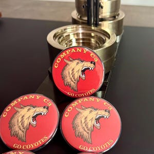 Custom logo pinback buttons, personalized business buttons, company logo badges, promotional marketing buttons, branded advertising products, trade show giveaways, corporate event merchandise, custom business branding.