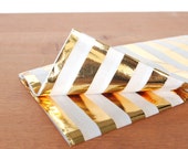 gold tissue paper: gold and white striped gift wrap, tissue, stuffing