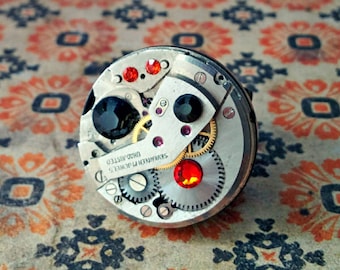 Steampunk Ring, mechanical watch movement CHC, antiqued silver on black ring, black an red rhinestones