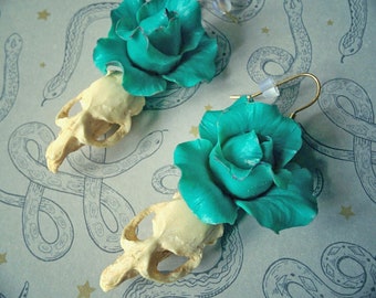 Cottage Witch earrings with faux mouse skull, and blue rose.