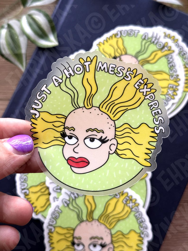 May include: A clear sticker featuring a cartoon character with yellow hair and red lips. The character is surrounded by a green circle with the text "JUST A HOT MESS EXPRESS" in white. Several stickers are visible.
