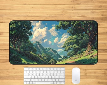 May include: A rectangular desk mat featuring a scenic landscape with a mountain range, trees, and a blue sky with clouds. A white keyboard and mouse are positioned below the mat on a wooden surface.