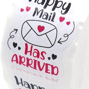 May include: Roll of white stickers with the phrases "Happy Mail" and "Has Arrived" in black and red. The stickers feature an envelope with a heart and small heart and arrow graphics.