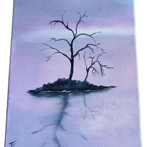 May include: An original painting on canvas depicts a bare tree on a small island, reflected in the water below. The artwork features a muted color palette of purples and blues, creating a serene and contemplative scene.