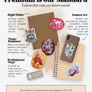 May include: An assortment of colorful stickers with various designs, including a raccoon, a lamb, a snail, and a duck. The stickers are displayed with a brown envelope, a notebook, and a phone case. Text on the image reads "Premium is our Standard".