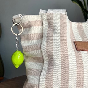 Handmade clay lime keychain, unique miniature fruit accessory, cute lime bag charm for keys or backpacks, or a gift for fruit lovers.