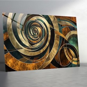 May include: Abstract art print featuring a spiral design with overlapping curved lines. The artwork uses a palette of gold, brown, teal, and black. The print is displayed on a wall, showcasing the artwork's intricate details and color variations.
