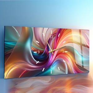 May include: Rectangular wall clock with a vibrant abstract design. The artwork features swirling ribbons of color in shades of teal, orange, pink, and gold. White numerals mark the hours, and gold-colored hands indicate the time.