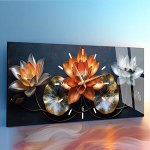 May include: A rectangular wall clock featuring a floral design. The clock face is adorned with three dimensional lotus flowers in shades of orange, silver, and white. The clock hands are gold, and the background is dark blue.