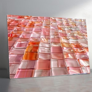 Puede incluir: Obra de arte abstracta que presenta un mosaico de baldosas de vidrio rectangulares. Las baldosas están dispuestas en un patrón de cuadrícula, con un degradado de colores que va del rosa al naranja. La obra se exhibe en una pared.