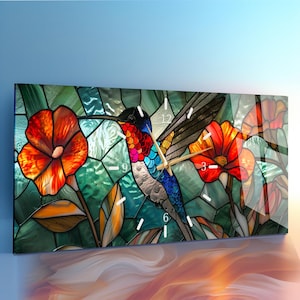May include: A rectangular wall clock featuring a stained glass style print of a hummingbird in flight surrounded by vibrant orange and red flowers against a teal and green geometric background with white hour markers and gold clock hands.