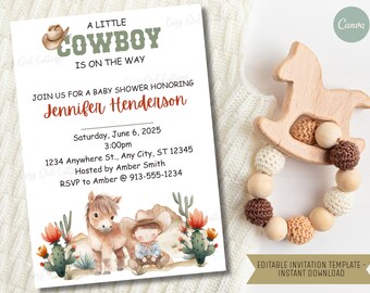 May include: A baby shower invitation with a cowboy theme. The invitation features watercolor illustrations of a cowboy, a horse, and cacti. The text reads "A Little Cowboy is on the Way." A wooden horse-shaped teether and a beaded toy are next to the invitation.