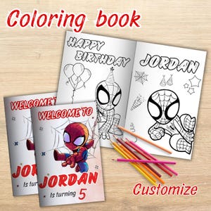 May include: A coloring book with a Spider-Man theme. The cover says "Welcome to Jordan" and "Jordan is turning 5." Inside, the pages say "Happy Birthday Jordan." Colored pencils are arranged on the wooden surface. The word "Customize" is also visible.